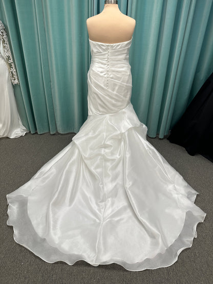 Ruched strapless fit-and-flare wedding dress with cat-eye neckline, asymmetrical skirt, and dramatic pickups by Stella York Style SY8123
