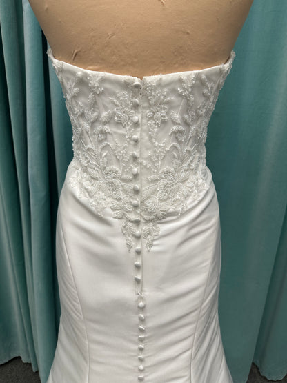Strapless Mikado fit-and-flare wedding dress with corset bodice, exposed boning, lace detailing, and dramatic lace train by Stella York Style SY8163