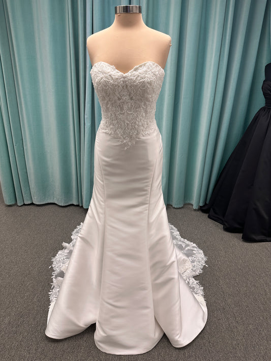 Strapless Mikado fit-and-flare wedding dress with corset bodice, exposed boning, lace detailing, and dramatic lace train by Stella York Style SY8163
