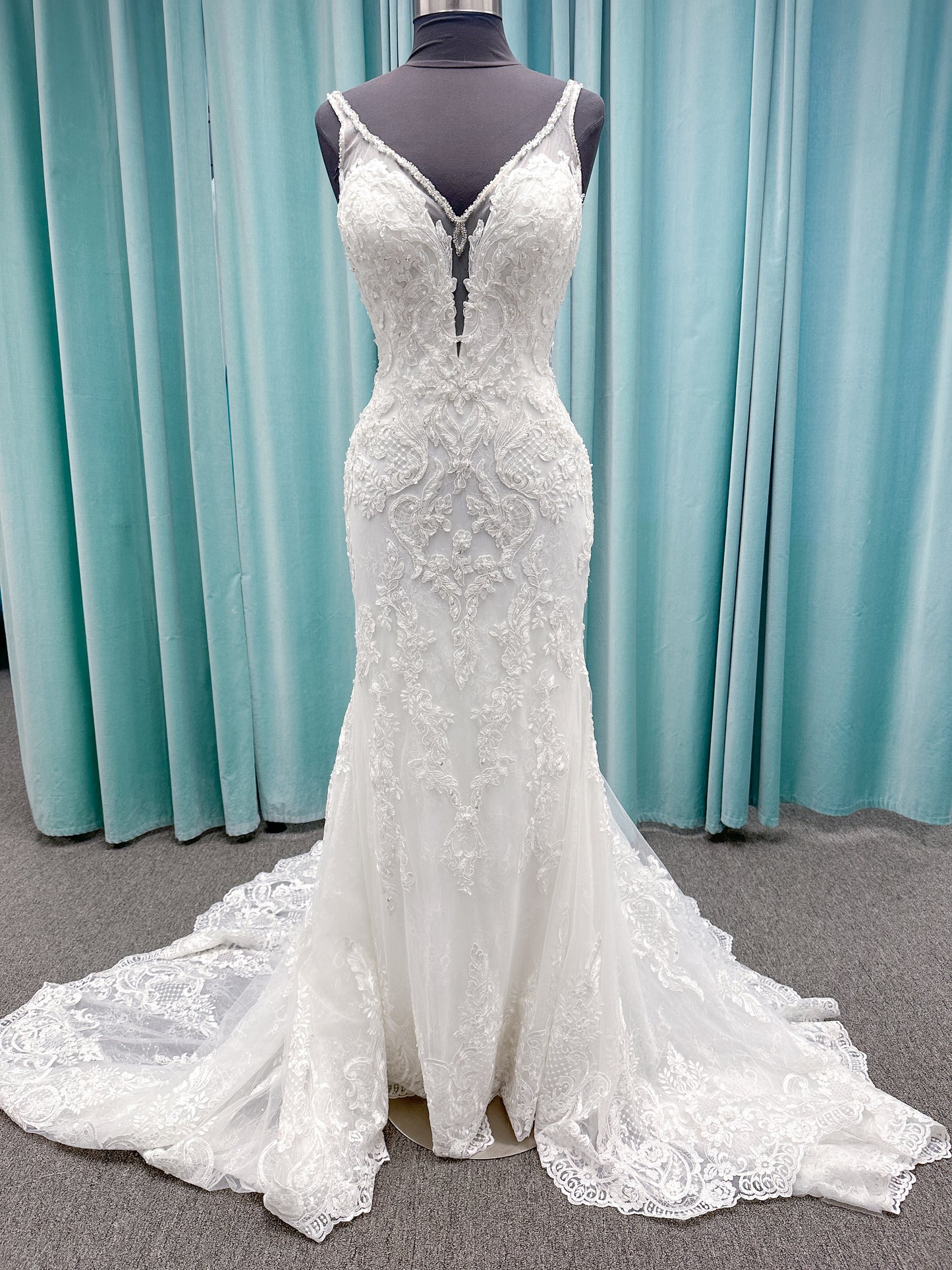Morilee 2139 Sofia fit and flare wedding dress with crystal-trimmed deep V-neck, Alençon lace appliqués on Chantilly lace net, scalloped hem, and sheer train.