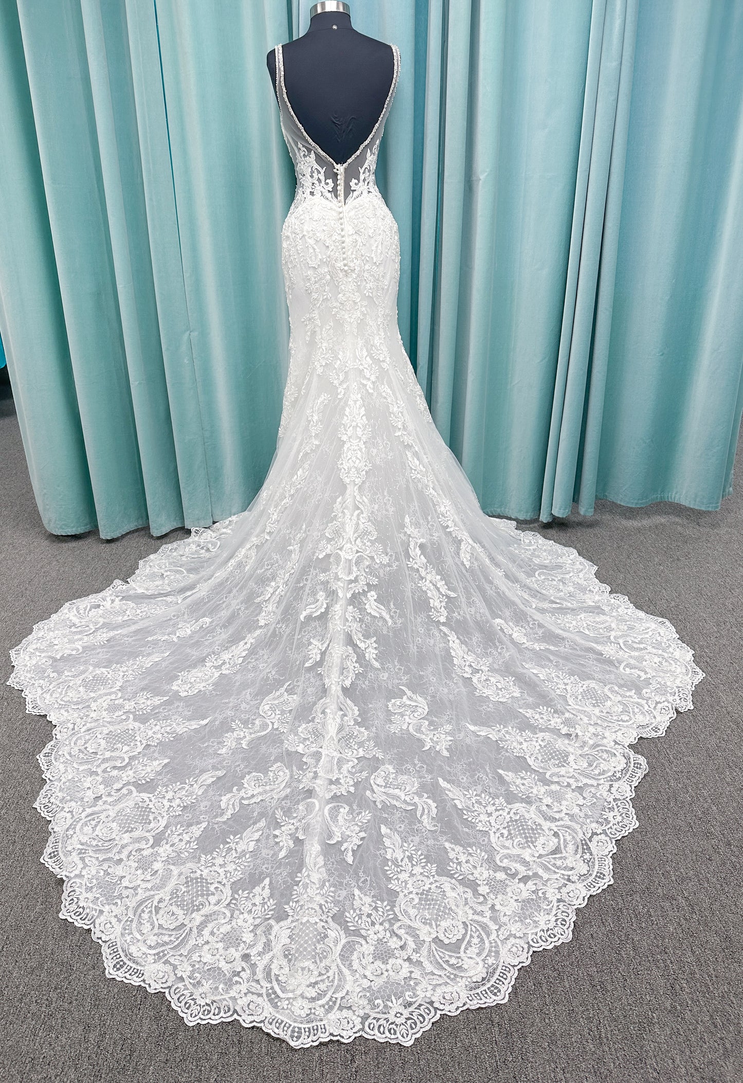 Morilee 2139 Sofia fit and flare wedding dress with crystal-trimmed deep V-neck, Alençon lace appliqués on Chantilly lace net, scalloped hem, and sheer train.