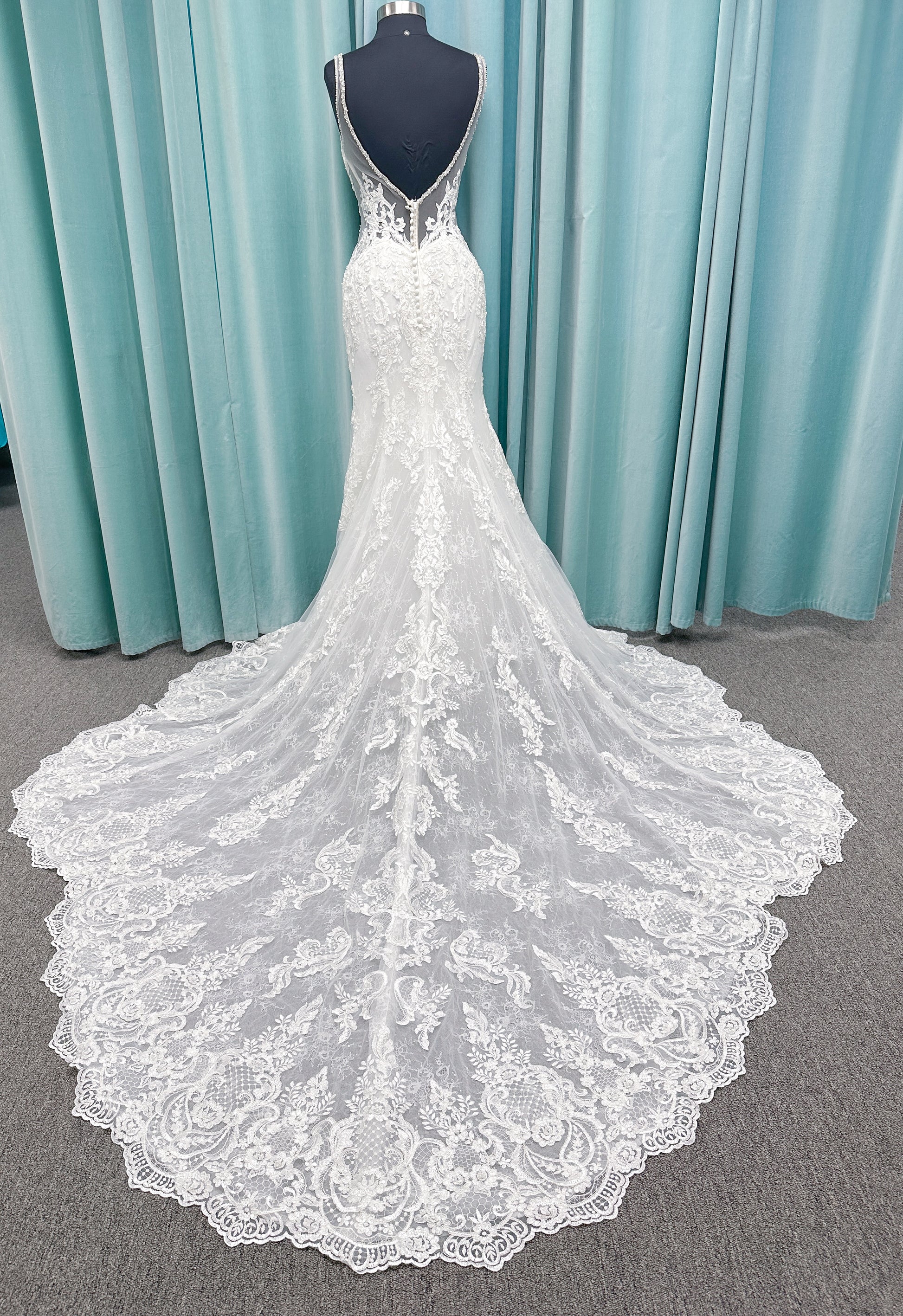 Morilee 2139 Sofia fit and flare wedding dress with crystal-trimmed deep V-neck, Alençon lace appliqués on Chantilly lace net, scalloped hem, and sheer train.