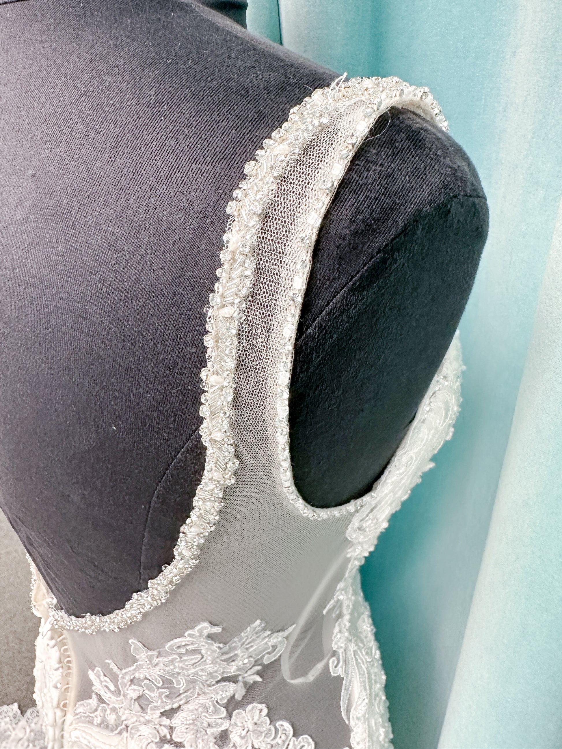 Morilee 2139 Sofia fit and flare wedding dress with crystal-trimmed deep V-neck, Alençon lace appliqués on Chantilly lace net, scalloped hem, and sheer train.
