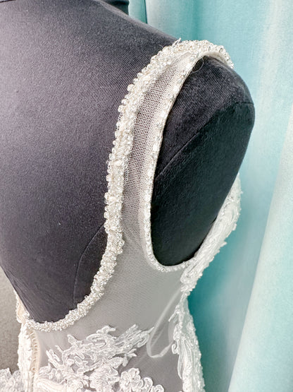 Morilee 2139 Sofia fit and flare wedding dress with crystal-trimmed deep V-neck, Alençon lace appliqués on Chantilly lace net, scalloped hem, and sheer train.