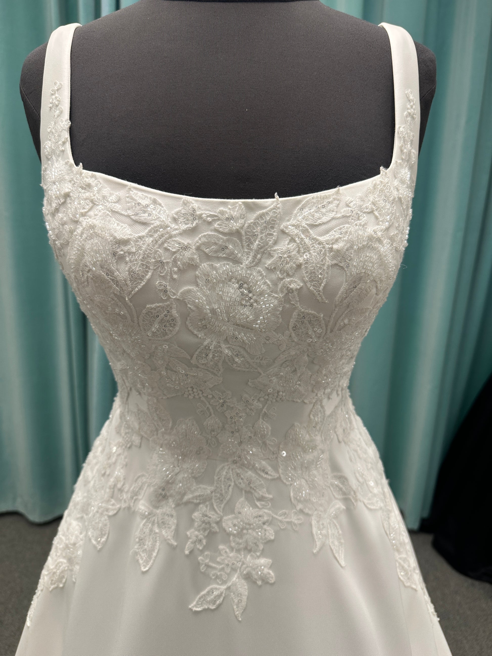 Stella York 7897 Mikado A-line wedding dress with square neckline, wide straps, lace bodice detail, and pockets