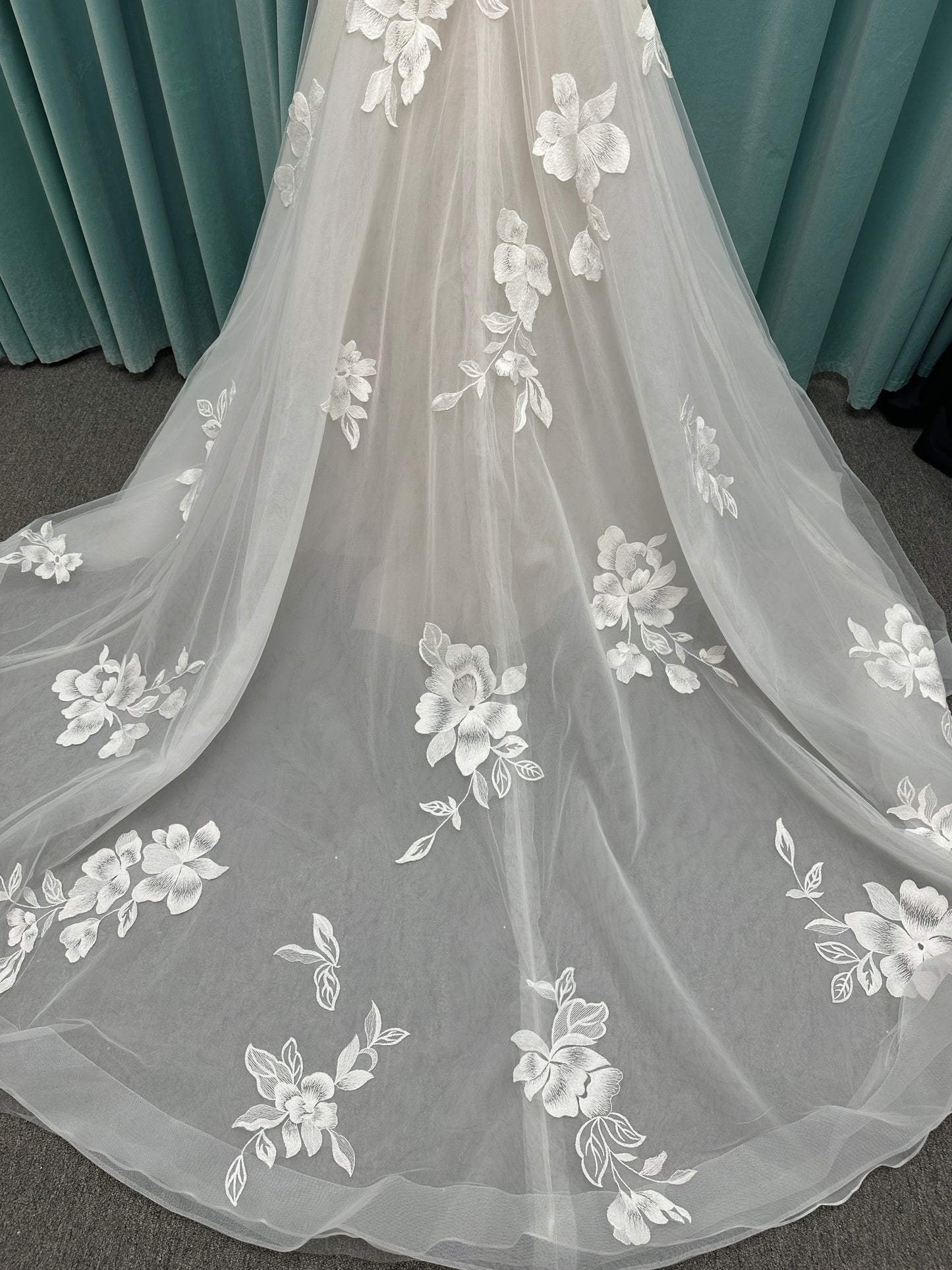 Strapless lace A-line wedding dress with sweetheart neckline, sheer corset bodice, and oversized floral lace appliqués by Stella York Style 7975
