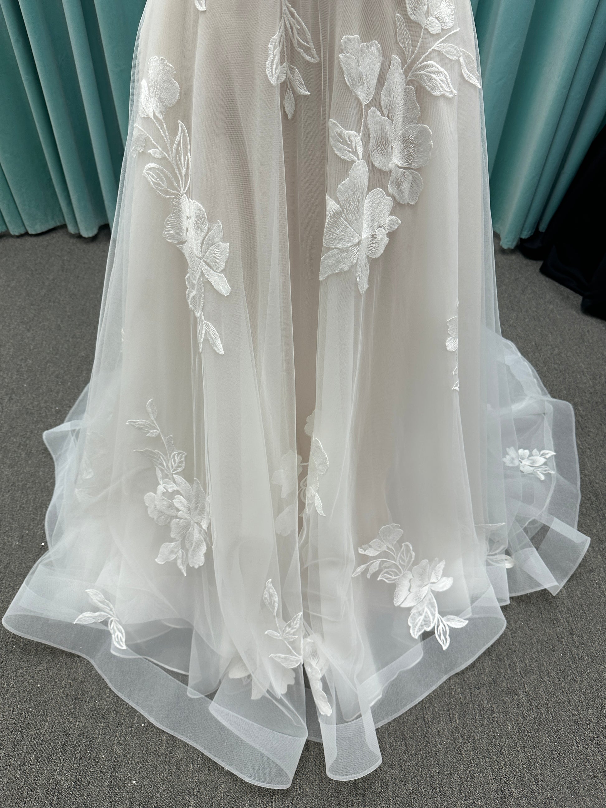 Strapless lace A-line wedding dress with sweetheart neckline, sheer corset bodice, and oversized floral lace appliqués by Stella York Style 7975