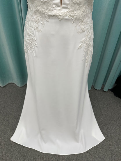 Stella York 7774 column sheath wedding dress with plunging neckline, lace appliqués, side cutouts, and crepe skirt with train