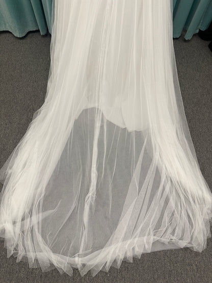 Stella York SY8113 colorful embroidered A-line wedding dress with twisted knot sweetheart neckline, sheer bodice, and soft pink tulle skirt