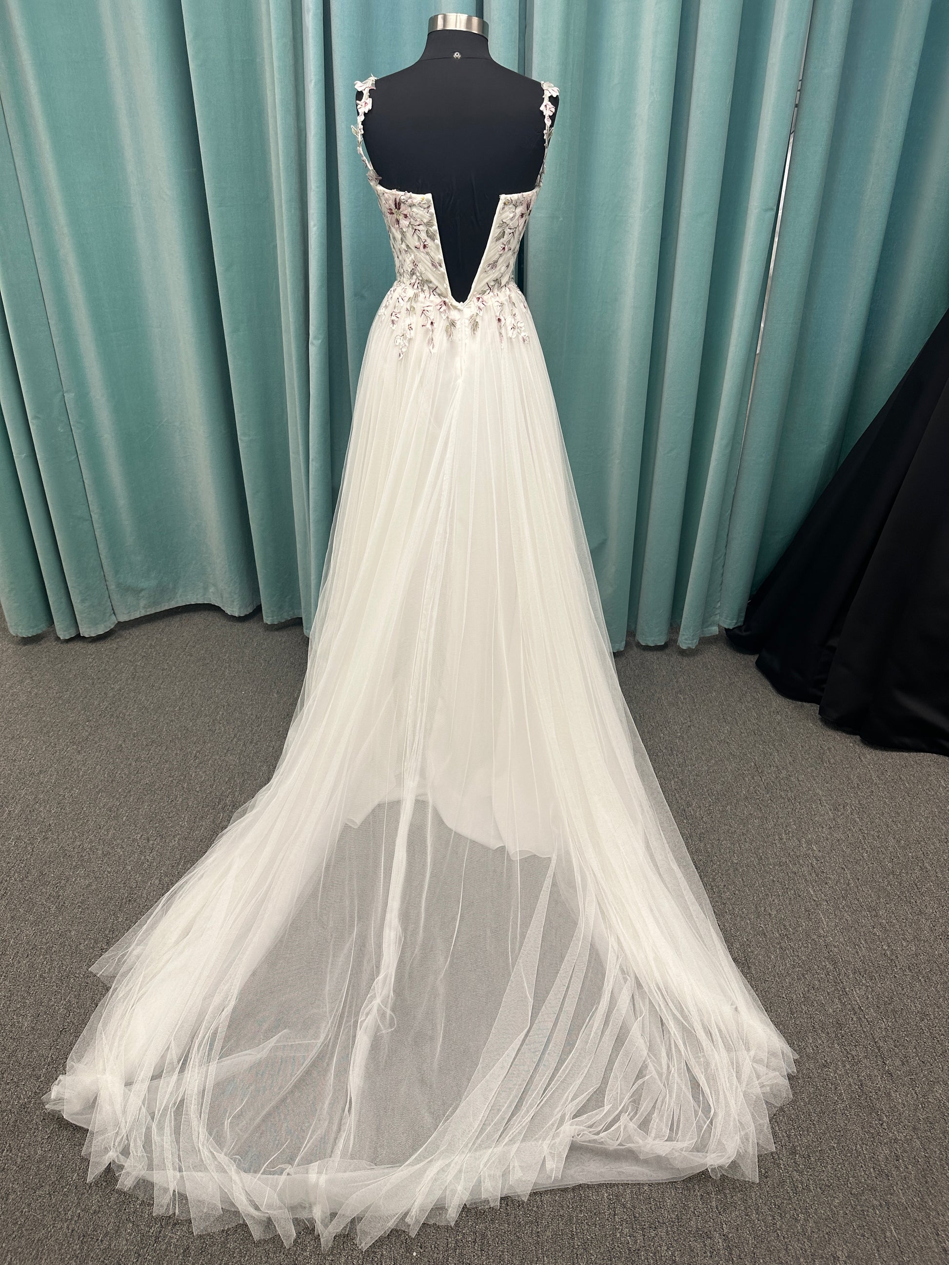 Stella York SY8113 colorful embroidered A-line wedding dress with twisted knot sweetheart neckline, sheer bodice, and soft pink tulle skirt