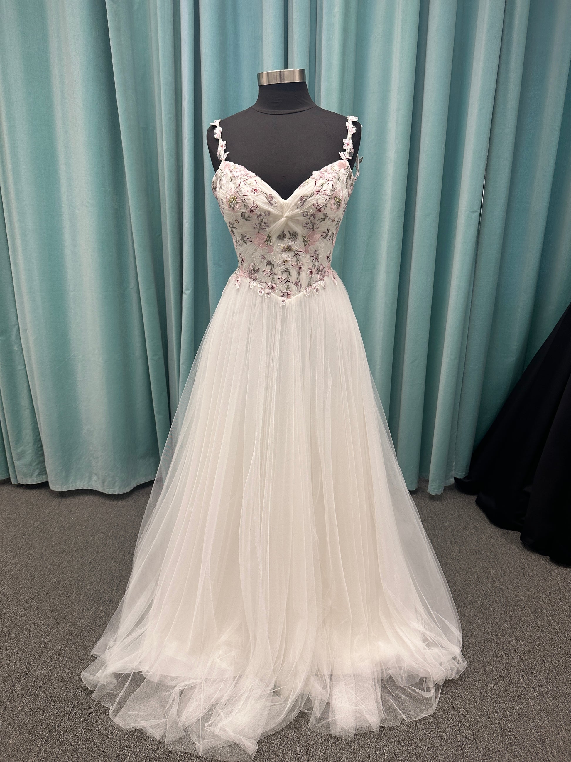 Stella York SY8113 colorful embroidered A-line wedding dress with twisted knot sweetheart neckline, sheer bodice, and soft pink tulle skirt
