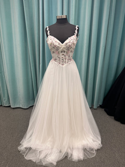 Stella York SY8113 colorful embroidered A-line wedding dress with twisted knot sweetheart neckline, sheer bodice, and soft pink tulle skirt
