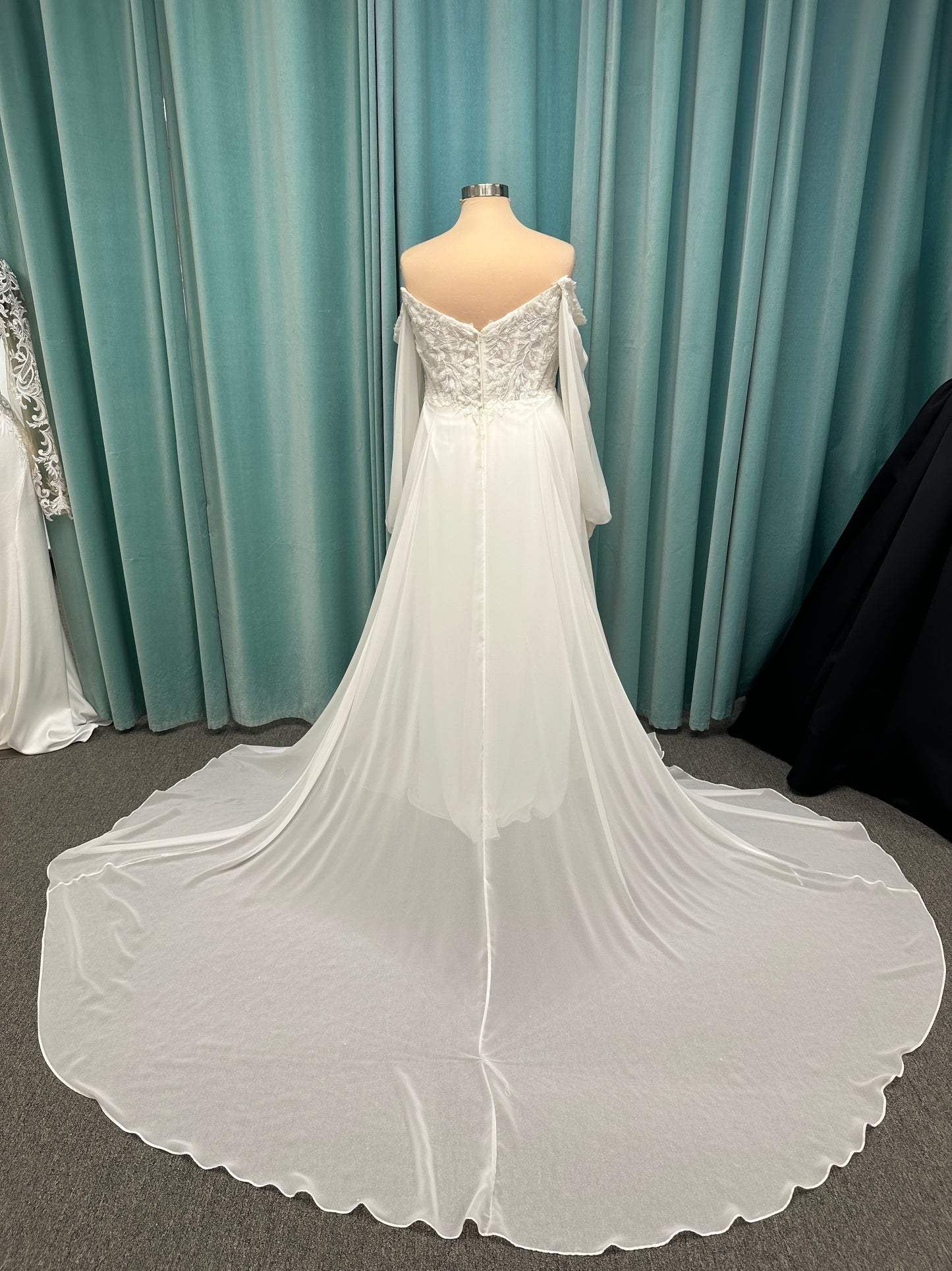 Plus size lace A-line wedding dress with detachable long blouson sleeves and flowing chiffon skirt