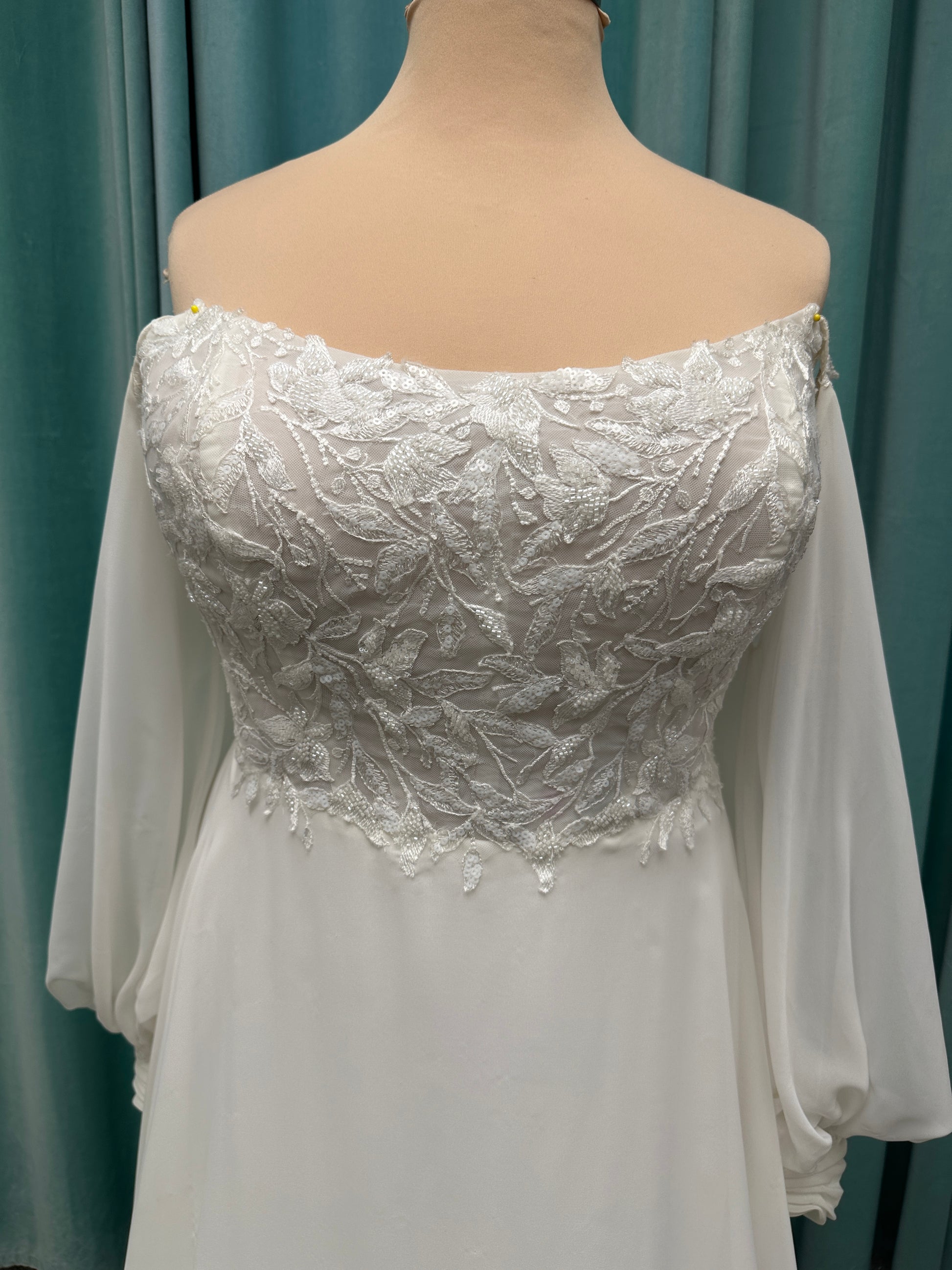 Plus size lace A-line wedding dress with detachable long blouson sleeves and flowing chiffon skirt