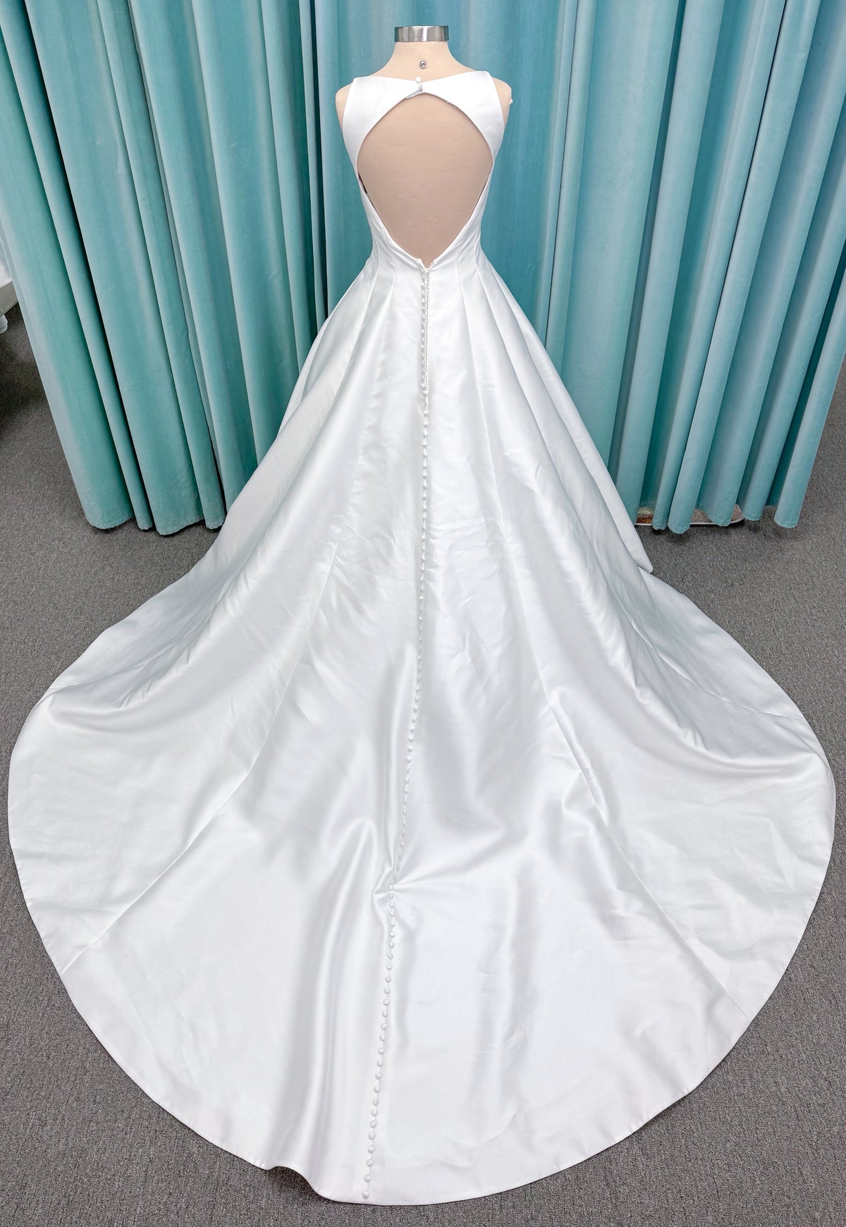 Morilee 1050007 Sylvia modest A-line wedding dress on mannequin with high neckline, crystal and pearl beaded embroidery, and flowing chiffon skirt