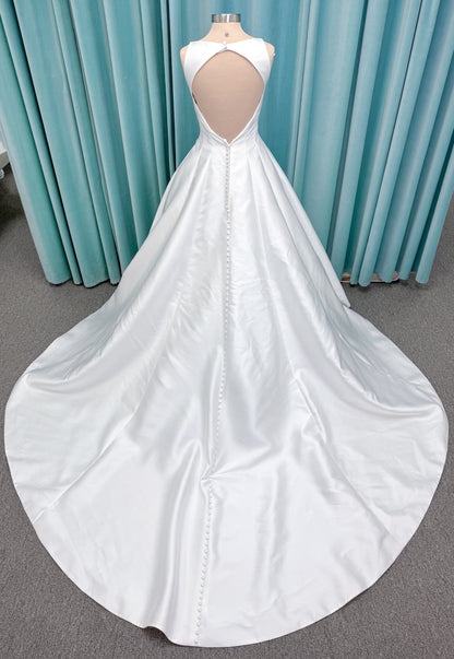 Morilee 1050007 Sylvia modest A-line wedding dress on mannequin with high neckline, crystal and pearl beaded embroidery, and flowing chiffon skirt