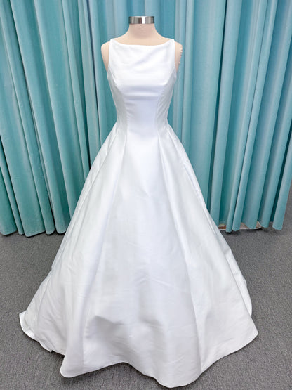 Morilee 1050007 Sylvia modest A-line wedding dress on mannequin with high neckline, crystal and pearl beaded embroidery, and flowing chiffon skirt