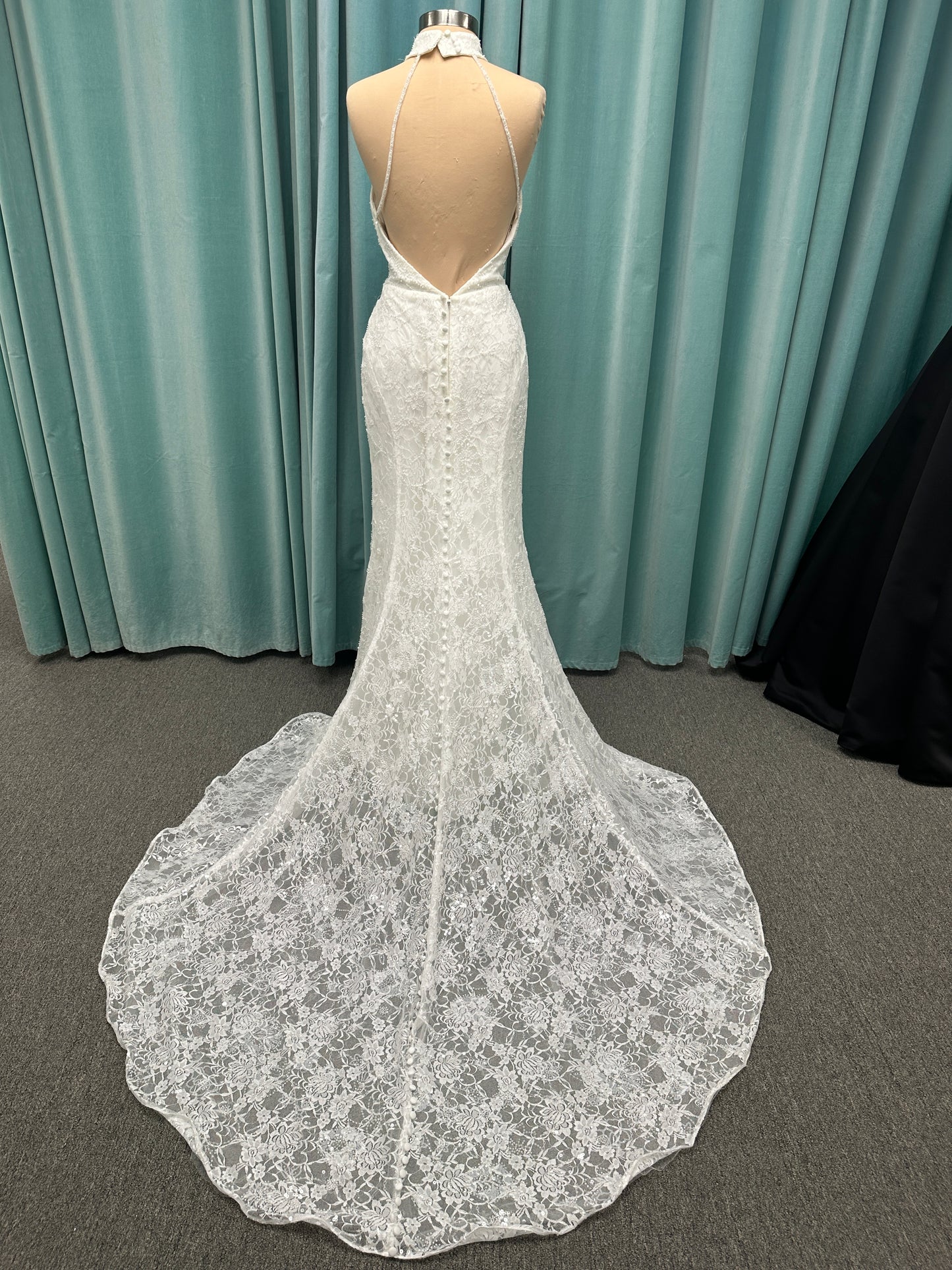 Stella York 7954 halter wedding dress with embellished floral lace, beaded detail, and fitted column silhouette with low back