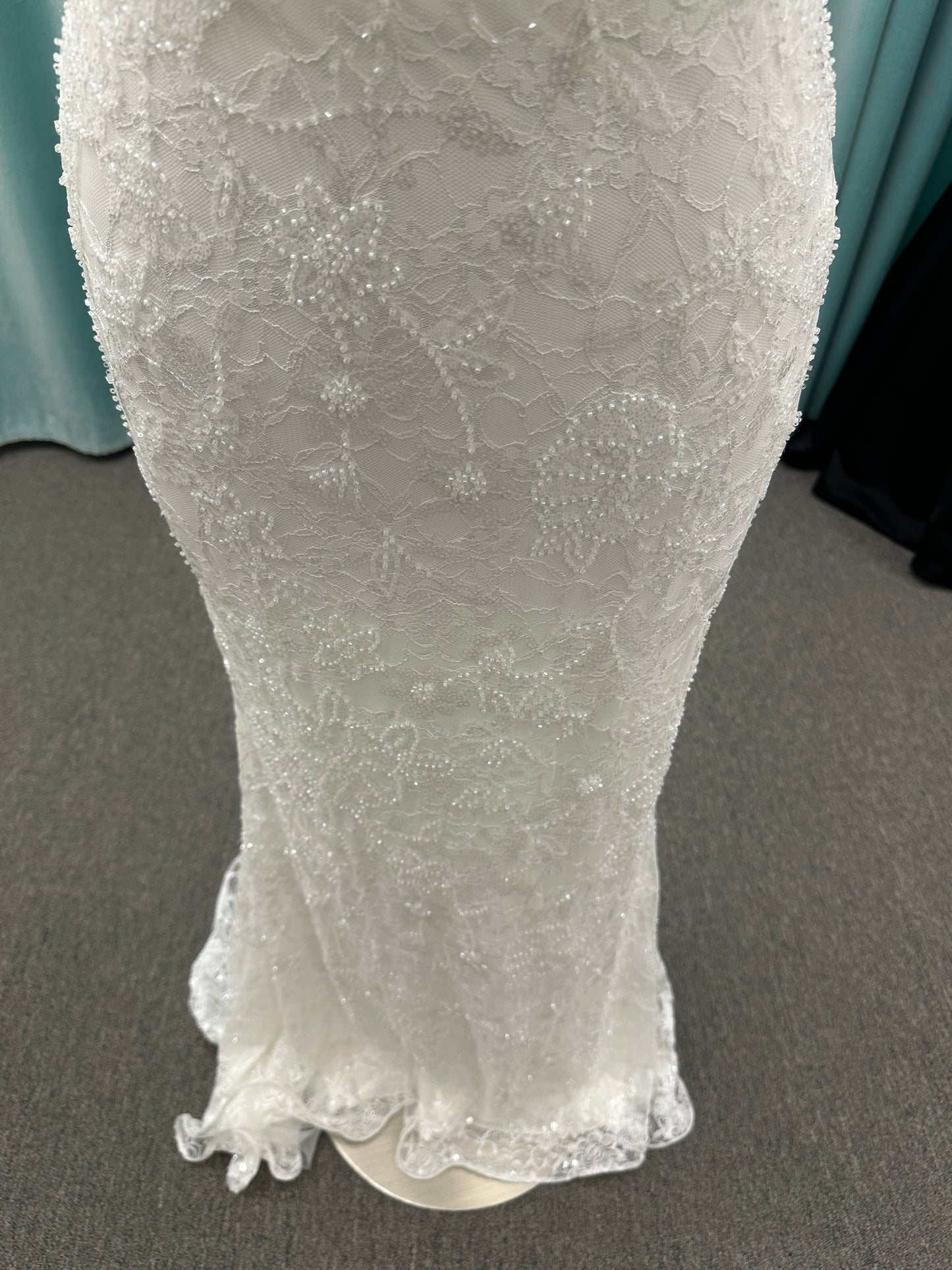 Stella York 7954 halter wedding dress with embellished floral lace, beaded detail, and fitted column silhouette with low back