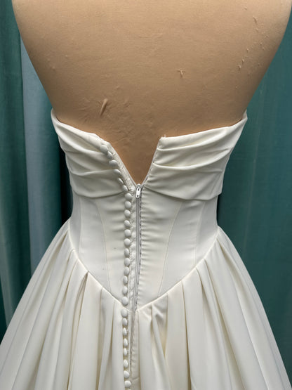Essense of Australia D4269 matte satin A-line wedding dress with strapless draped bodice and Basque waist