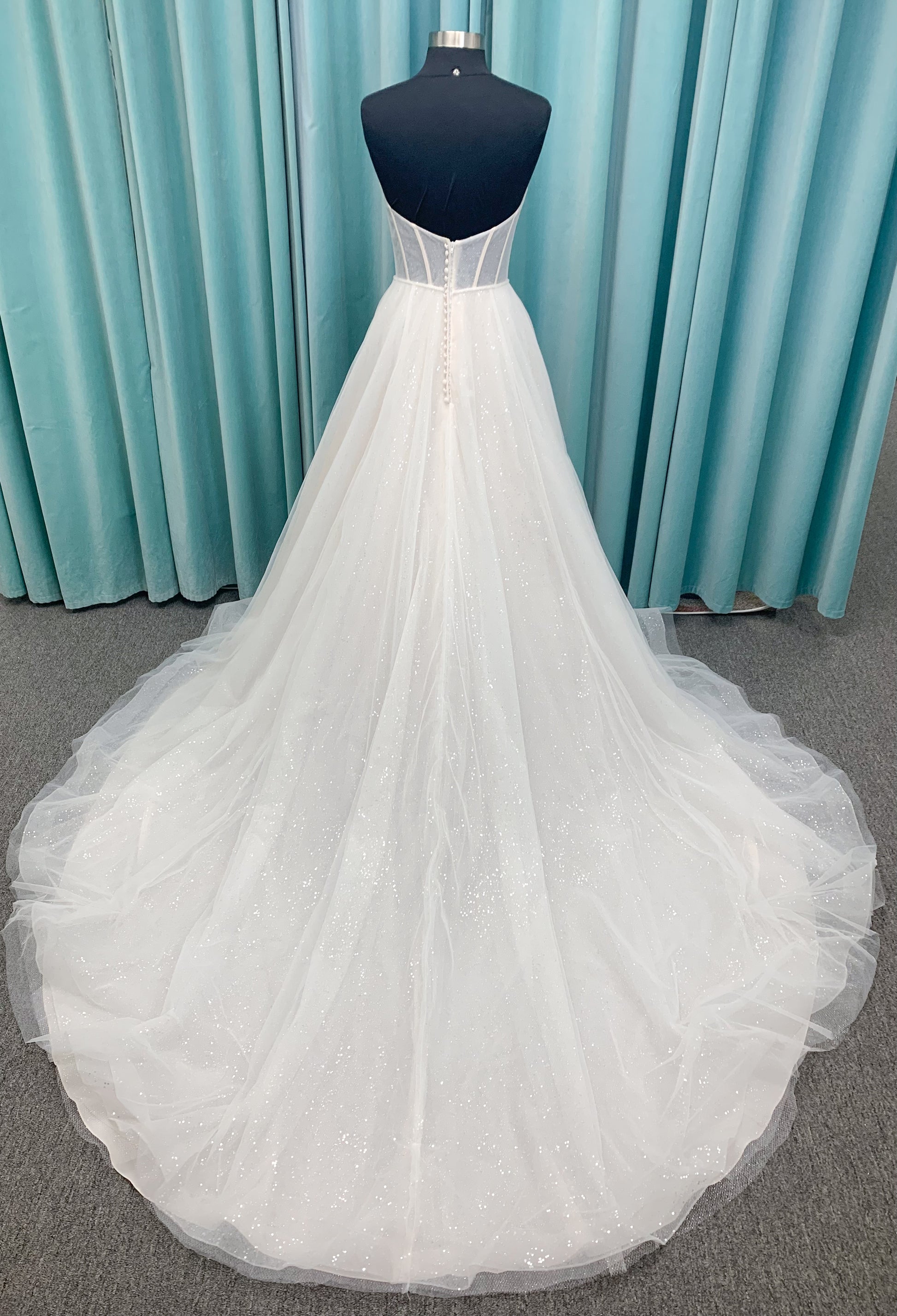 Morilee 15062 Tara A-line wedding dress in sparkle tulle over metallic net with strapless scoop neck, corset boning, and high front slit in Ivory/Champagne/Honey.