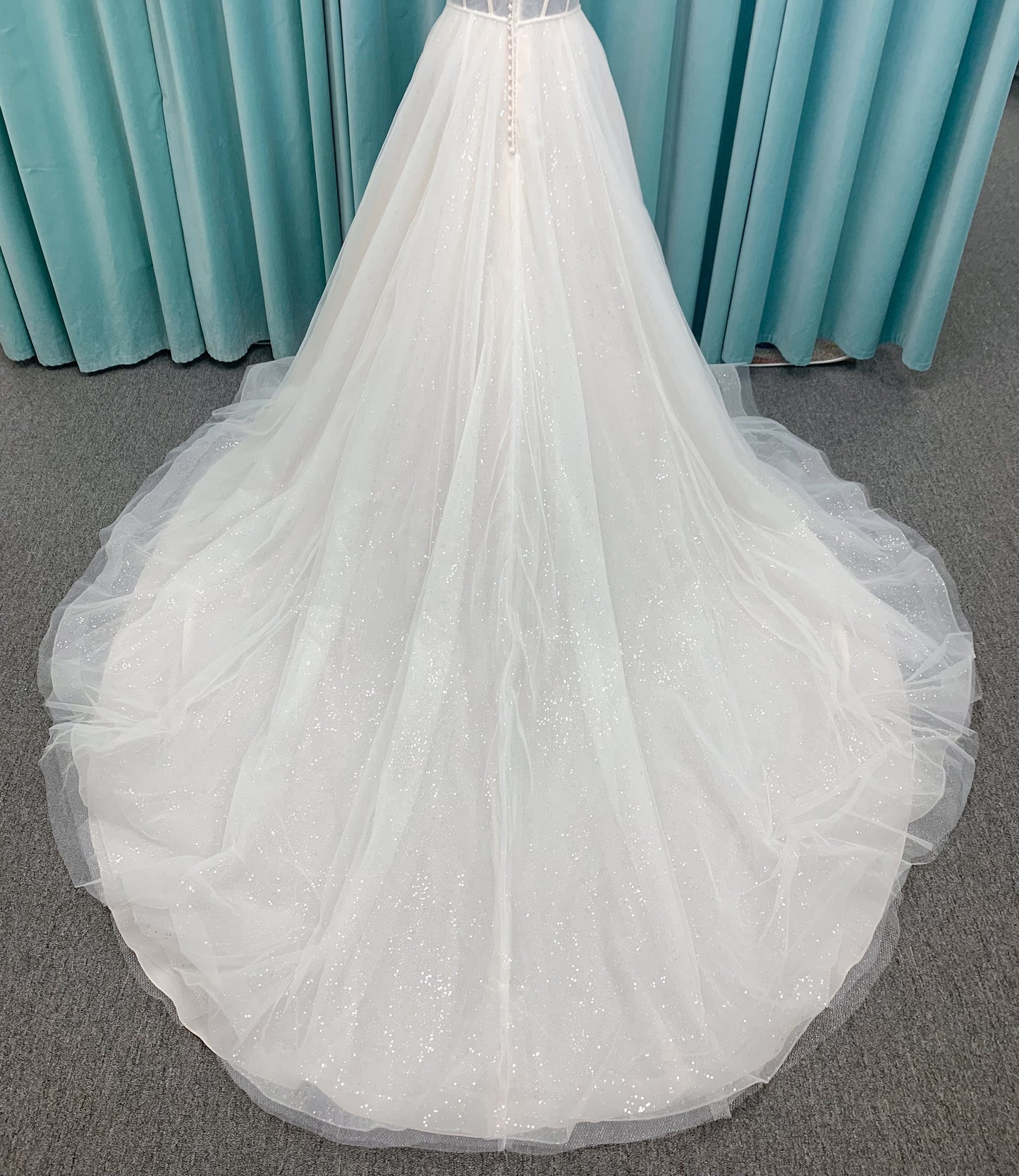 Morilee 15062 Tara A-line wedding dress in sparkle tulle over metallic net with strapless scoop neck, corset boning, and high front slit in Ivory/Champagne/Honey.