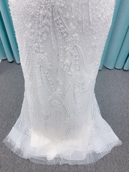 Morilee 1362 Tatianna fit and flare wedding dress with spaghetti straps, allover pearl and crystal beaded net, and sheer corset-boned back in Ivory/Champagne/Honey.