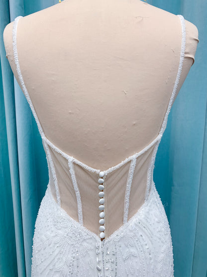 Morilee 1362 Tatianna fit and flare wedding dress with spaghetti straps, allover pearl and crystal beaded net, and sheer corset-boned back in Ivory/Champagne/Honey.