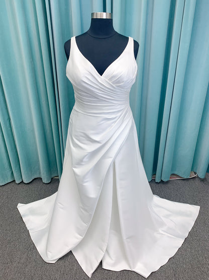 Morilee 3437 Tia plus size A-line wedding dress in stretch Larissa satin with V-neckline, sheer corset back, front slit, and classic buttons to hem.