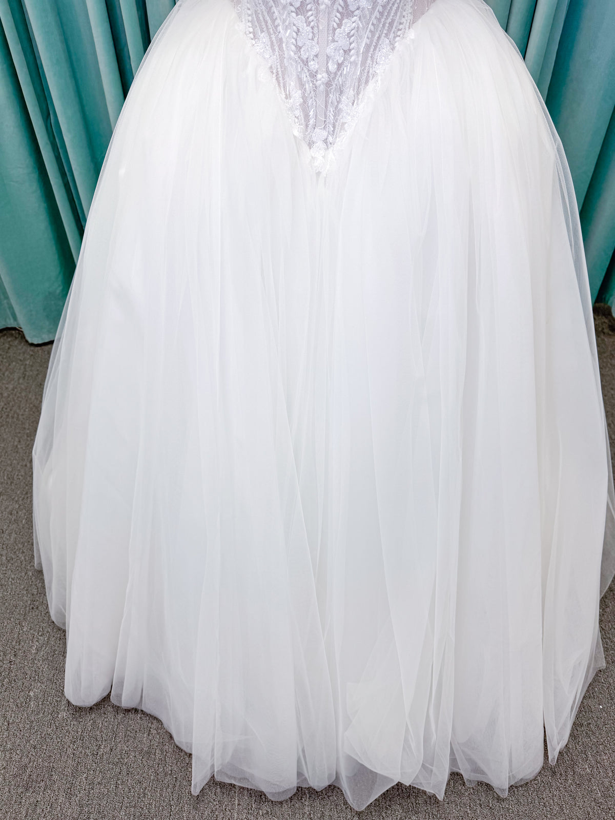 Morilee 1010036 Virtuoso ballgown wedding dress on mannequin with scoop neckline, off-the-shoulder tulle sleeves, beaded bodice, and lace-up corset back