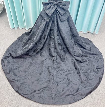 Wednesday Ballgown Wedding Dress in Black Brocade, Size 10 — floral jacquard, strapless neckline, oversized bow back