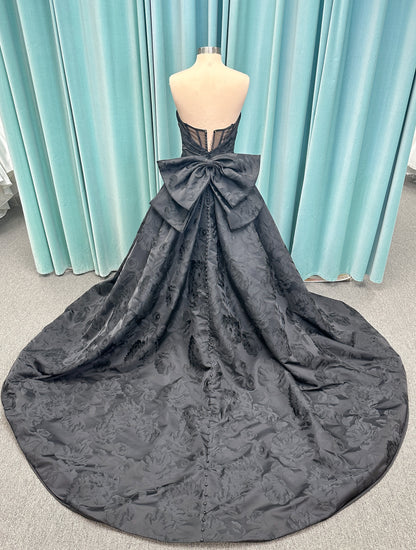 Wednesday Ballgown Wedding Dress in Black Brocade, Size 10 — floral jacquard, strapless neckline, oversized bow back