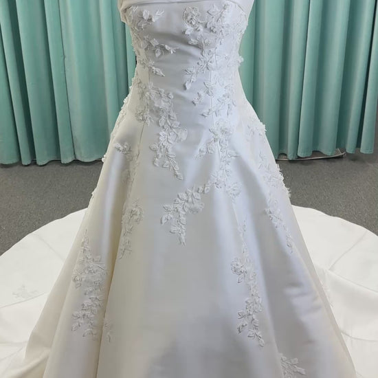 Essense of Australia D4195 ivory lace and Mikado drop-waist wedding dress on mannequin with strapless square neckline, 3D appliqué bodice, and A-line skirt.
