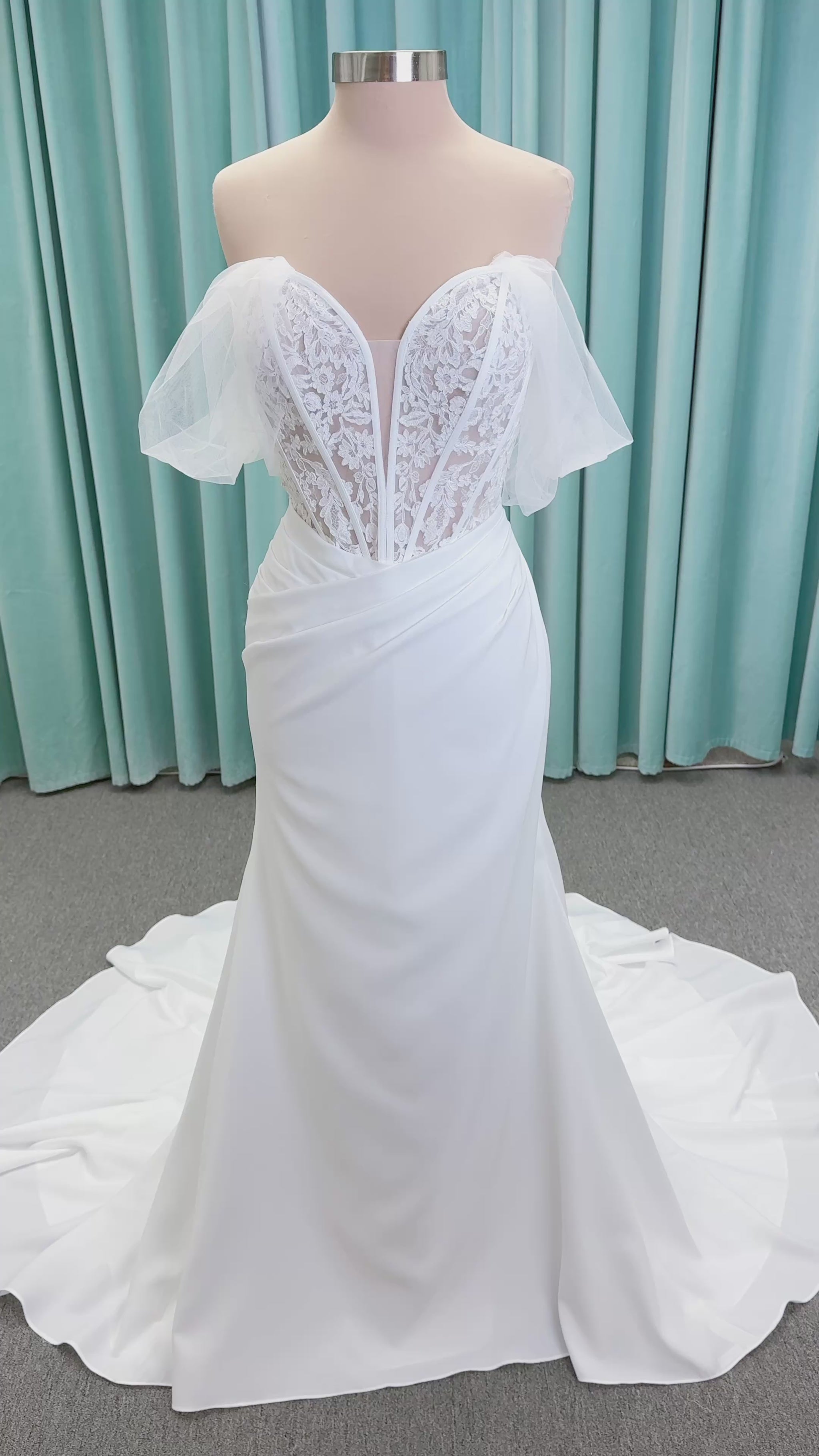 Morilee 1050008 Plie fit and flare wedding dress on mannequin with fluid draping and clean silhouette