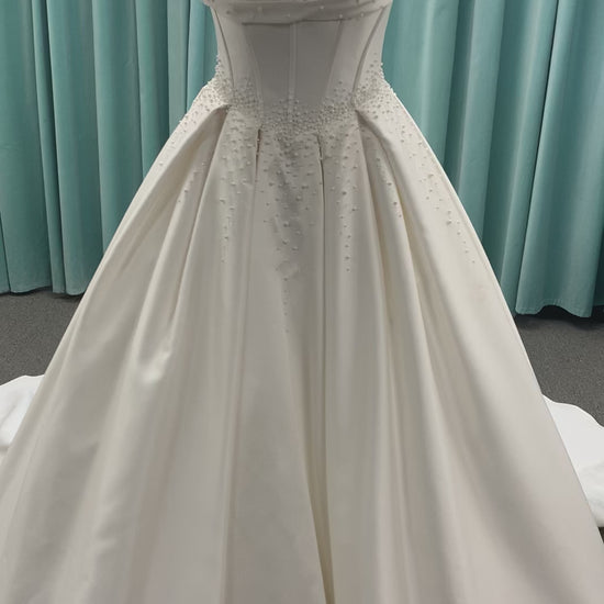 Essense of Australia D4418 Mikado ballgown with draped square neckline, ruched bodice, cascading pearl straps, and full pleated skirt