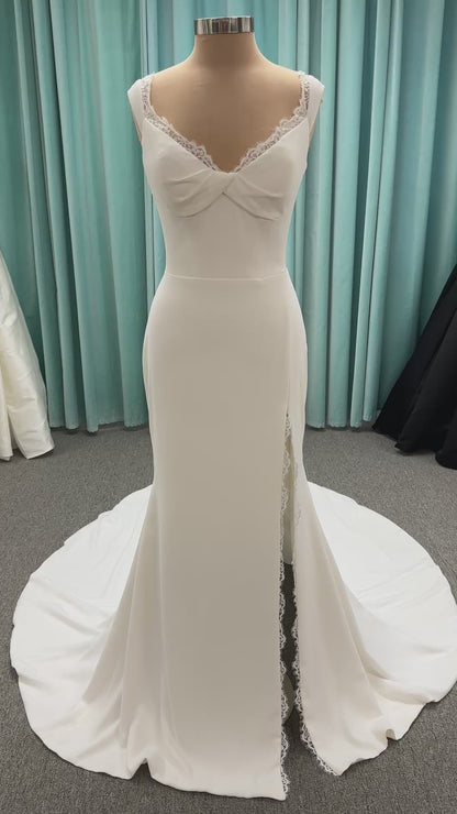 Morilee Scottie wedding dress Style 2711 with off-the-shoulder neckline, twist draped bodice, and lace-trimmed sheath skirt with slit