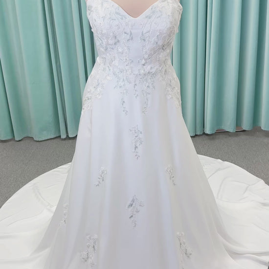 Morilee 4471 Roberta plus size wedding dress on mannequin with angular strapless neckline, 3D floral beaded embroidery, and satin A-line skirt