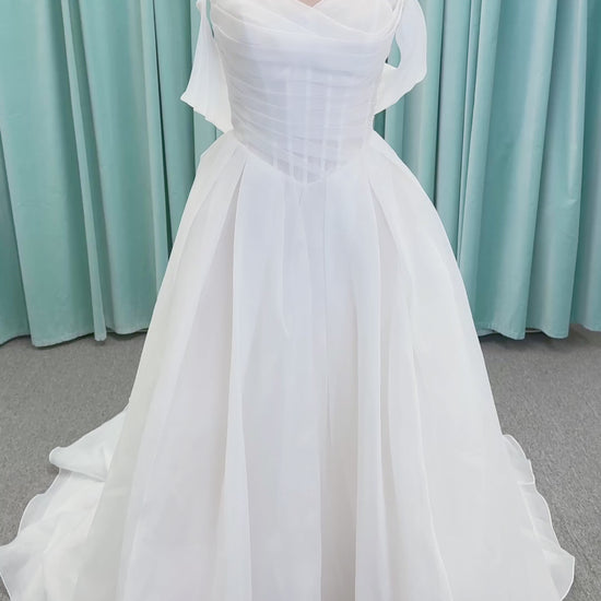 Morilee 2947L Damara A-line wedding dress on mannequin with modified sweetheart neckline, off-the-shoulder detailing, organza box pleats, and corset back