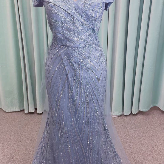 Morilee MLNY 73110 mermaid mother of the bride dress on mannequin with off-the-shoulder sweetheart neckline with foldover cuff, sequin-beaded net bodice, sheer tulle back panel, and sweep train