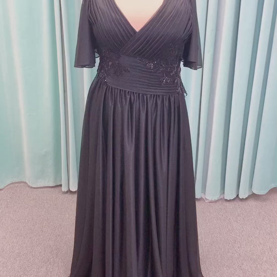 Morilee MLNY 73102 plus size A-line mother of the bride dress on mannequin with asymmetrically draped V-neck bodice, flutter sleeves, embroidered beaded appliques, and shimmer mesh A-line skirt