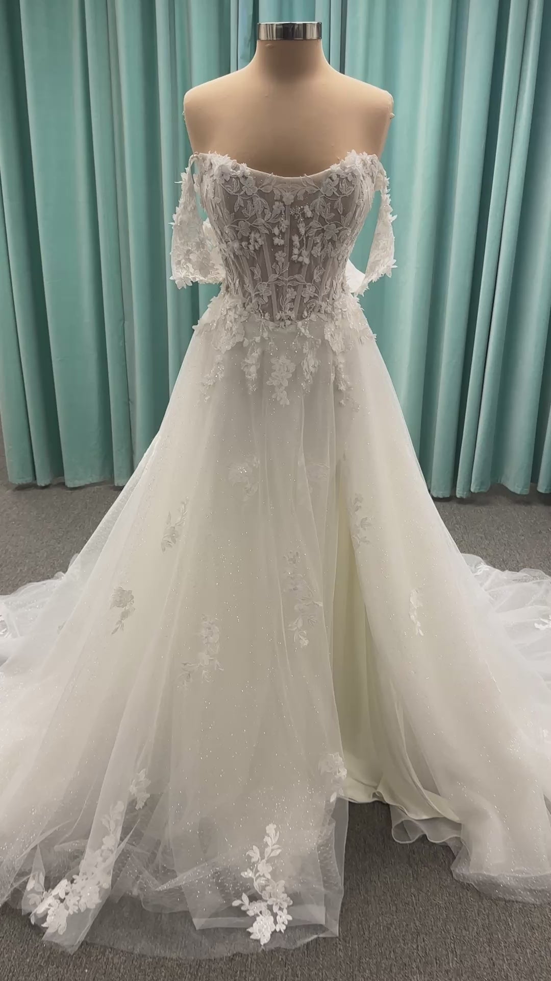 Off-the-shoulder lace A-line wedding dress with corset bodice, 3D floral appliqués, and glitter tulle skirt by Essense of Australia style D4360