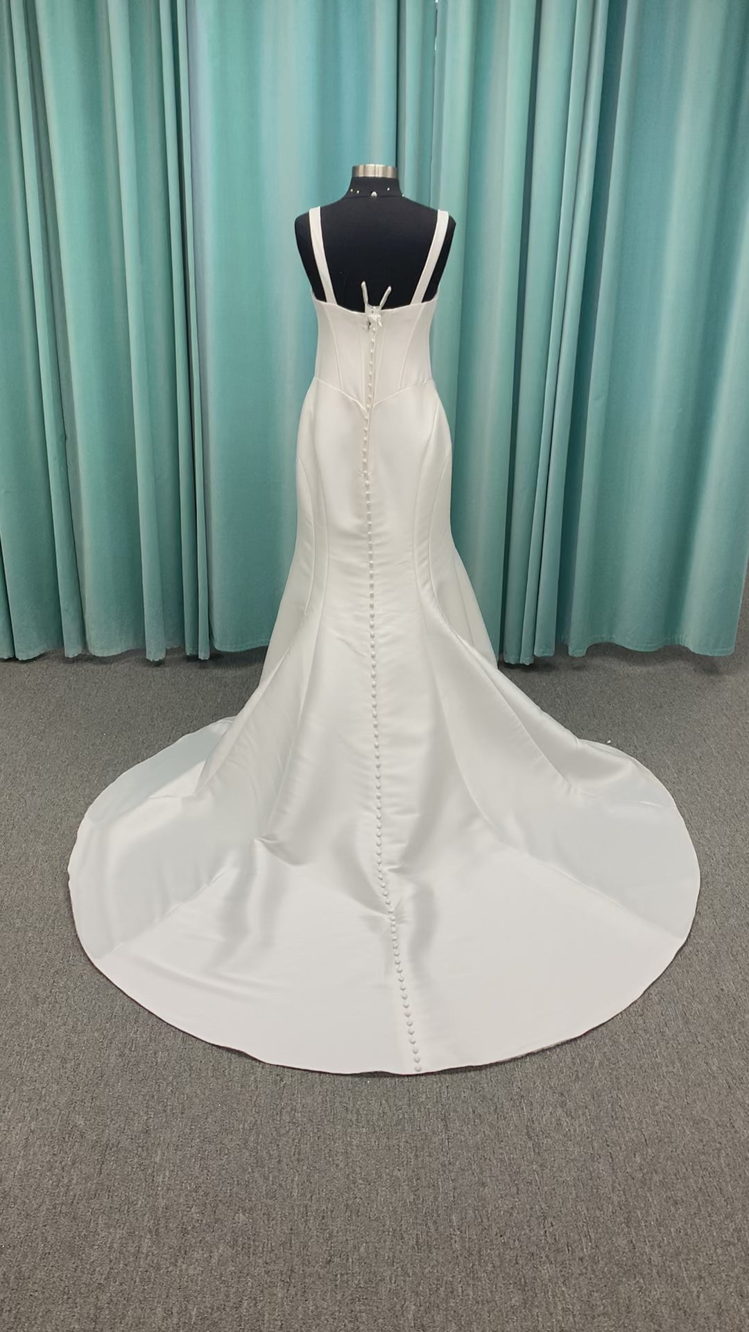 Stella York SY8148 ivory fit-and-flare wedding dress on mannequin featuring a modest scoop neckline, wide straps, and structured corset bodice.
