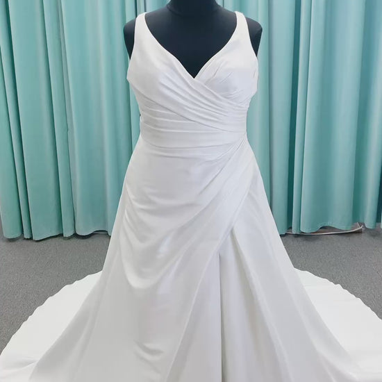 Morilee 3437 Tia plus size A-line wedding dress in stretch Larissa satin with V-neckline, sheer corset back, front slit, and classic buttons to hem.