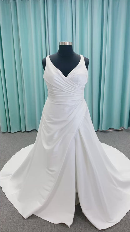 Morilee 3437 Tia plus size A-line wedding dress in stretch Larissa satin with V-neckline, sheer corset back, front slit, and classic buttons to hem.