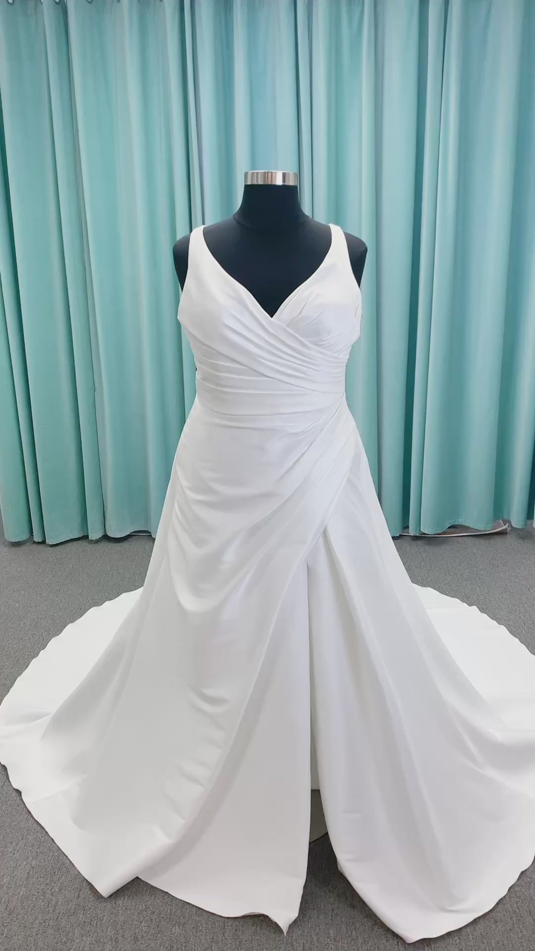 Morilee 3437 Tia plus size A-line wedding dress in stretch Larissa satin with V-neckline, sheer corset back, front slit, and classic buttons to hem.