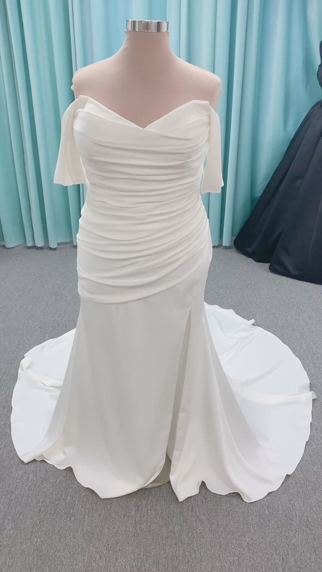 Morilee 4473 Reba plus size A-line wedding dress in Larissa satin with cowl strapless neck, detachable organza bow tie straps, and covered buttons to hem.