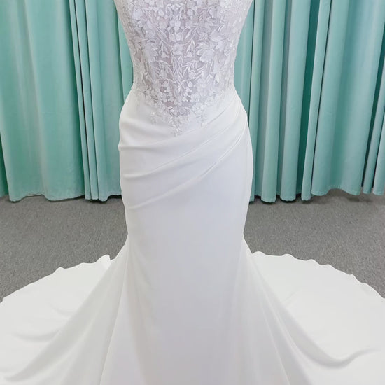 Randy Fenoli Kitty fit and flare wedding dress on mannequin with strapless sweetheart neckline, floral lace appliqué, and fluid crepe skirt