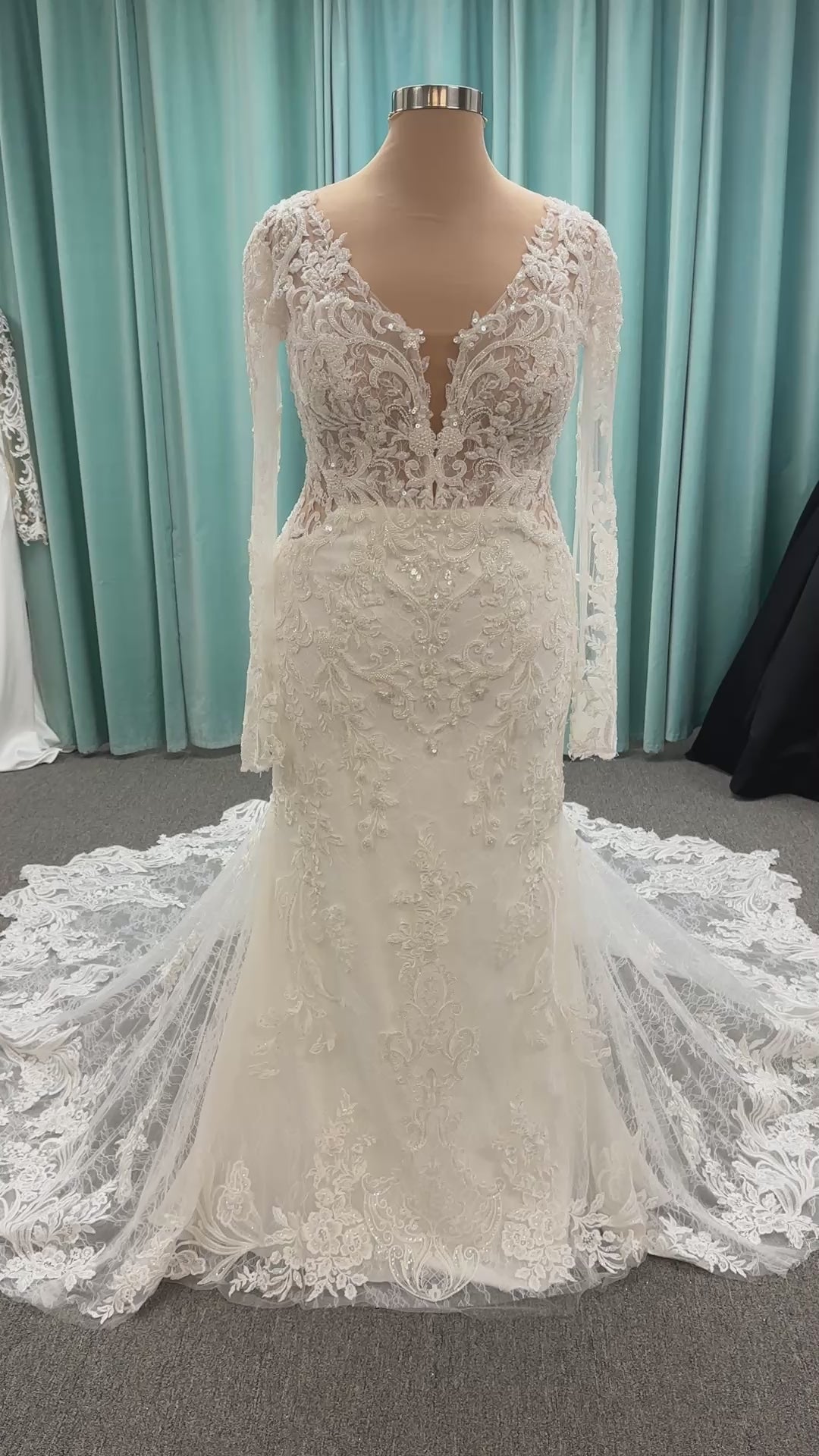Essense of Australia D4213 lace fit-and-flare wedding dress with plunging neckline and sheer lace sleeves featuring a long lace train