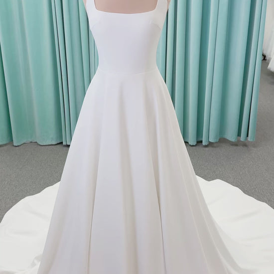 A-Line Ivory wedding dress on mannequin with square neckline and matte crepe A-line skirt
