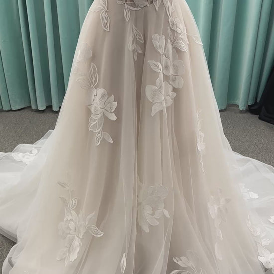 Strapless lace A-line wedding dress with sweetheart neckline, sheer corset bodice, and oversized floral lace appliqués by Stella York Style 7975